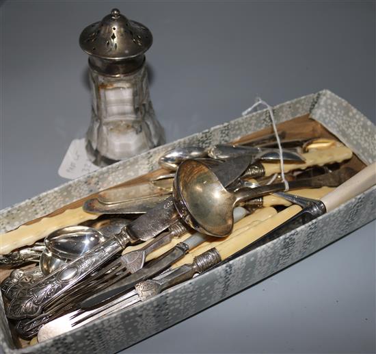 A group of assorted silver and plated cutlery, including a Victorian sauce ladle and a silver mounted sugar castor